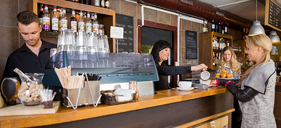 photo of people at coffee counter in convenience store