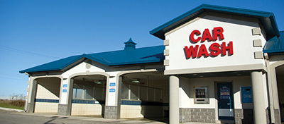 Image of the exterior front face of a commercial car wash business