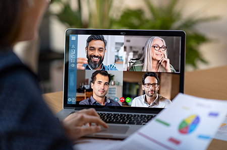 photo of business woman video conferencing with colleagues