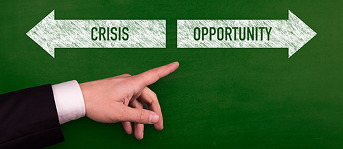 man's hand pointing to opportunity arrow on green background