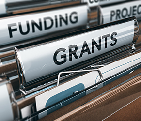 file folders with tabs for funding and grants