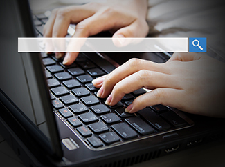 woman using laptop to search for keywords