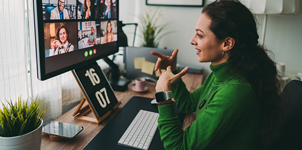 photo of remote employee engaging with team over video meeting