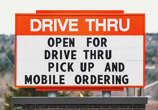 picture of sign says open for drive thru pick up and mobile ordering