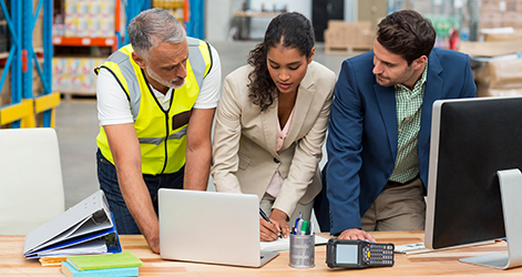 photo showing warehouse workers and vendor working together