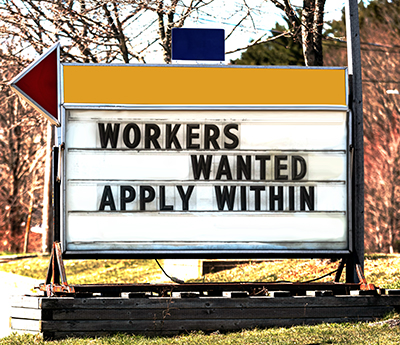 picture of sign saying workers wanted apply within